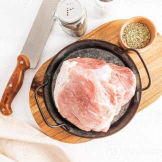 juicy tenderloin of farm pork to prepare a delicious lunch top view of the meat and ingredients for cooking white background photo